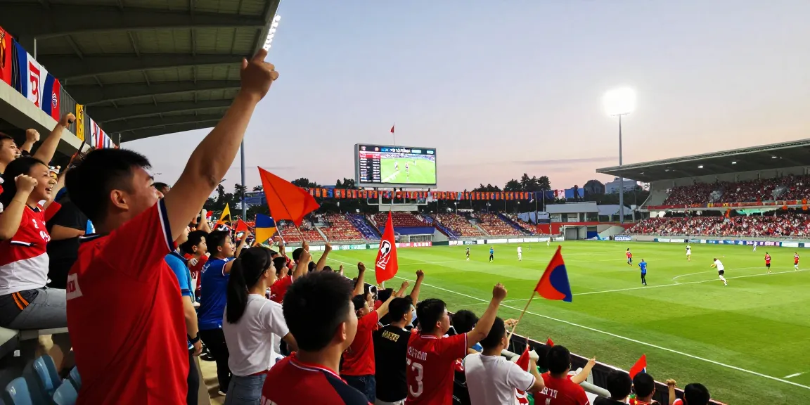 Live koora match atmosphere with fans cheering and players in action in a vibrant stadium.